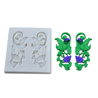Gli strumenti e gli utensili di cottura del silicone modella la forma del ramo dell'uva per la decorazione del dolce